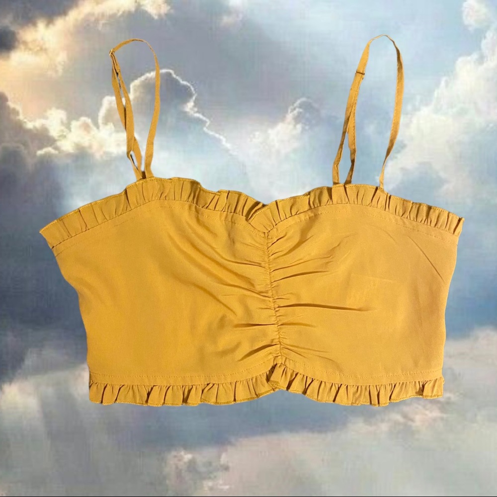 Urban Outfitters golden ruched bra top with ruffled hem.